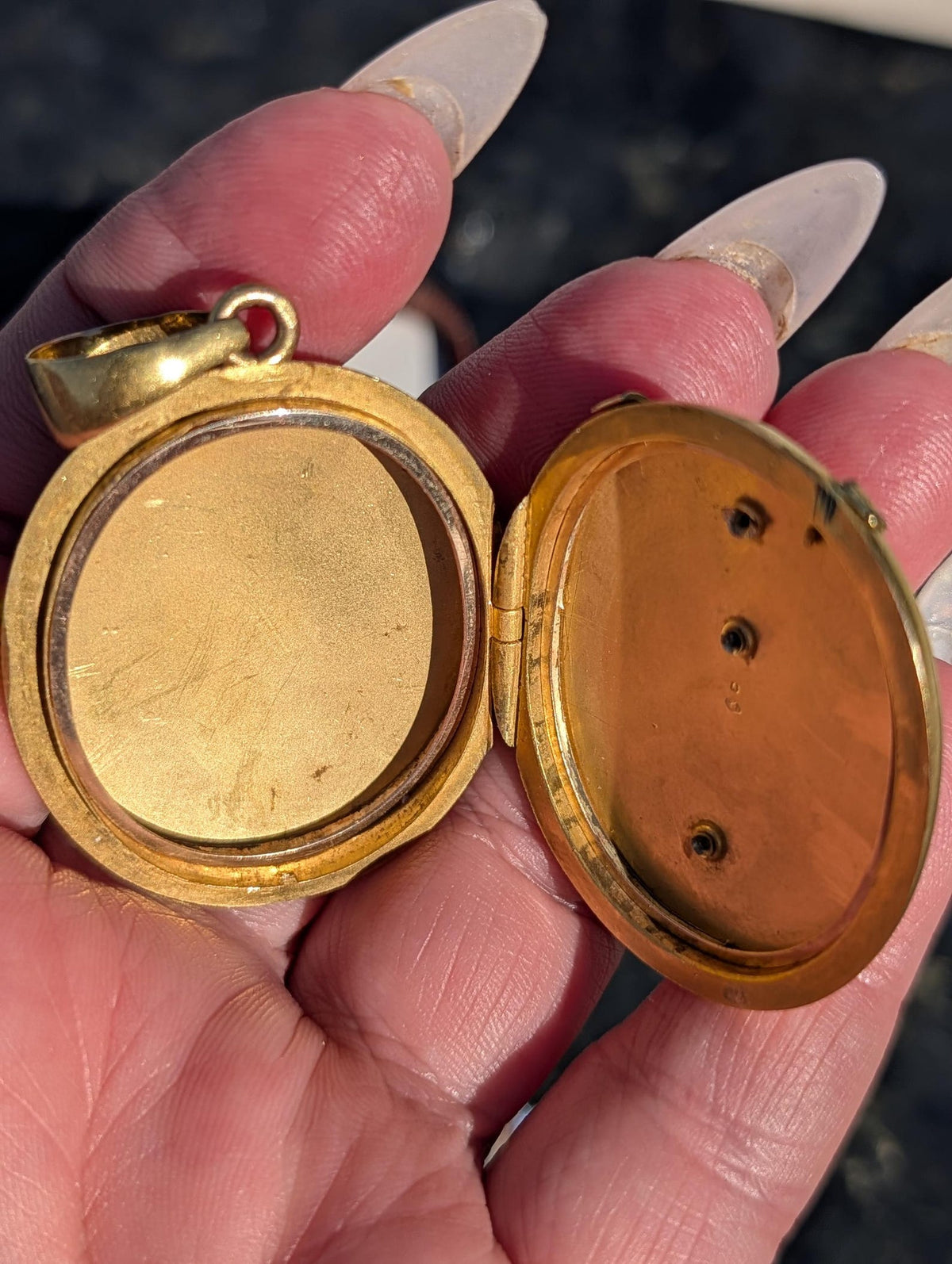 Open Victorian gold photograph locket